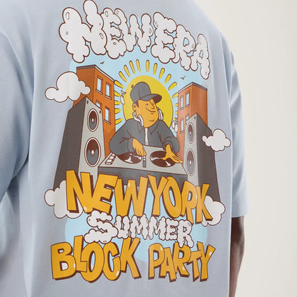 The model is wearing this New Era Fun Block Party Graphic Oversized T-Shirt in pastel blue. 8