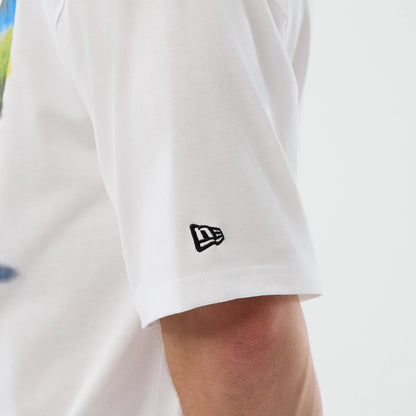 The model is wearing this New Era Beach Graphic Oversized T-Shirt in white. 7