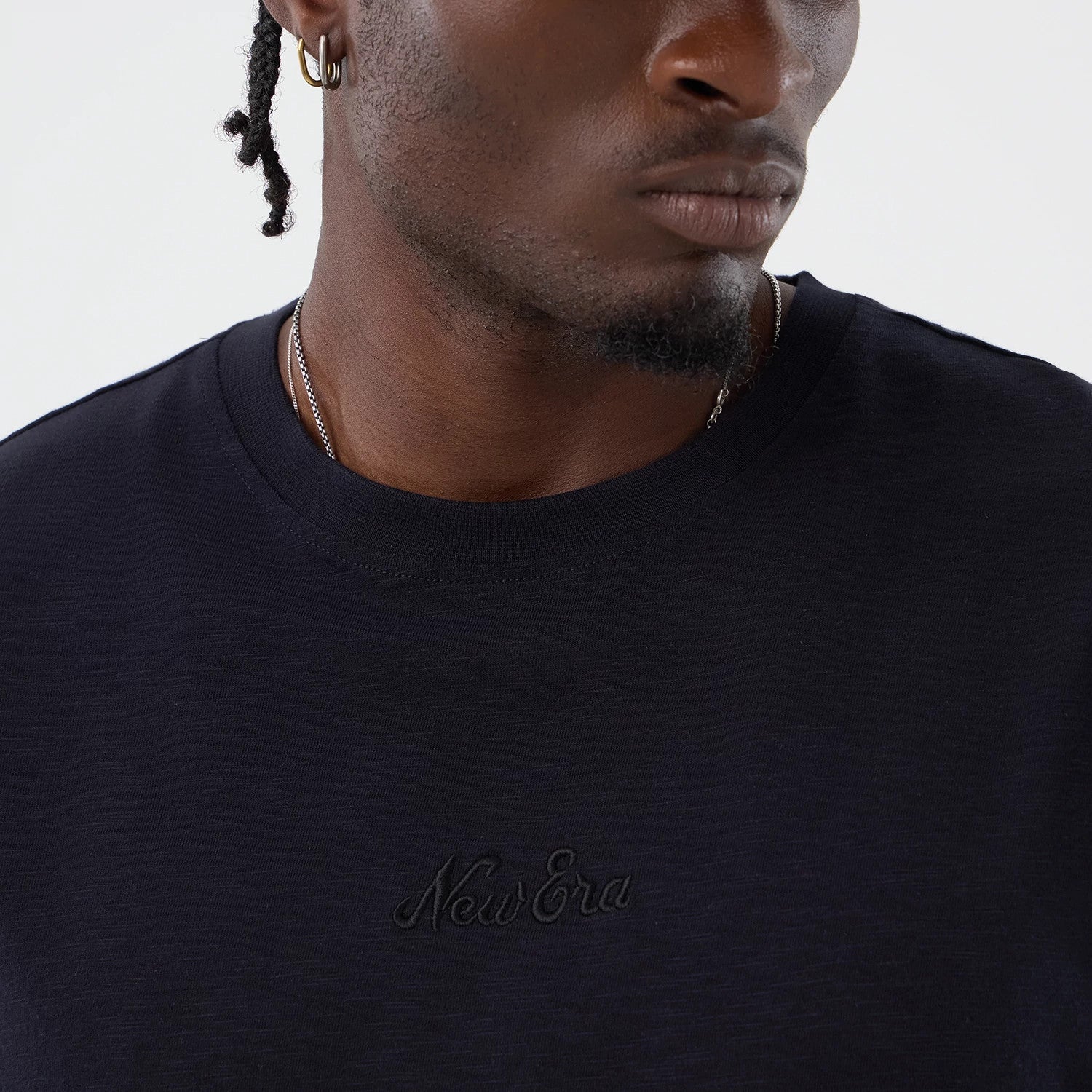 The model is wearing this New Era Slub Oversized T-Shirt in navy. 4