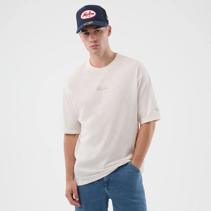 The model is wearing this New Era Slub Oversized T-Shirt in open white. 7