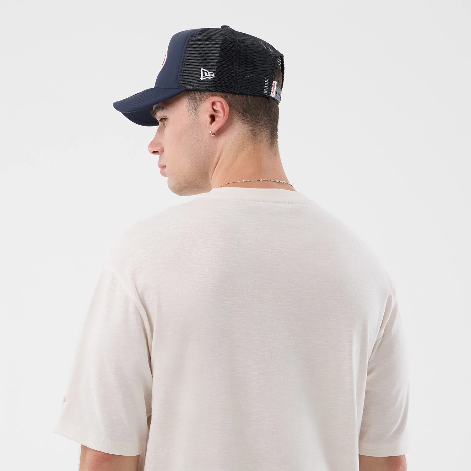The model is wearing this New Era Slub Oversized T-Shirt in open white. 4