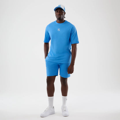 The model is wearing this MLB League Essential New York Yankees Oversized T-Shirt in pastel blue. 8
