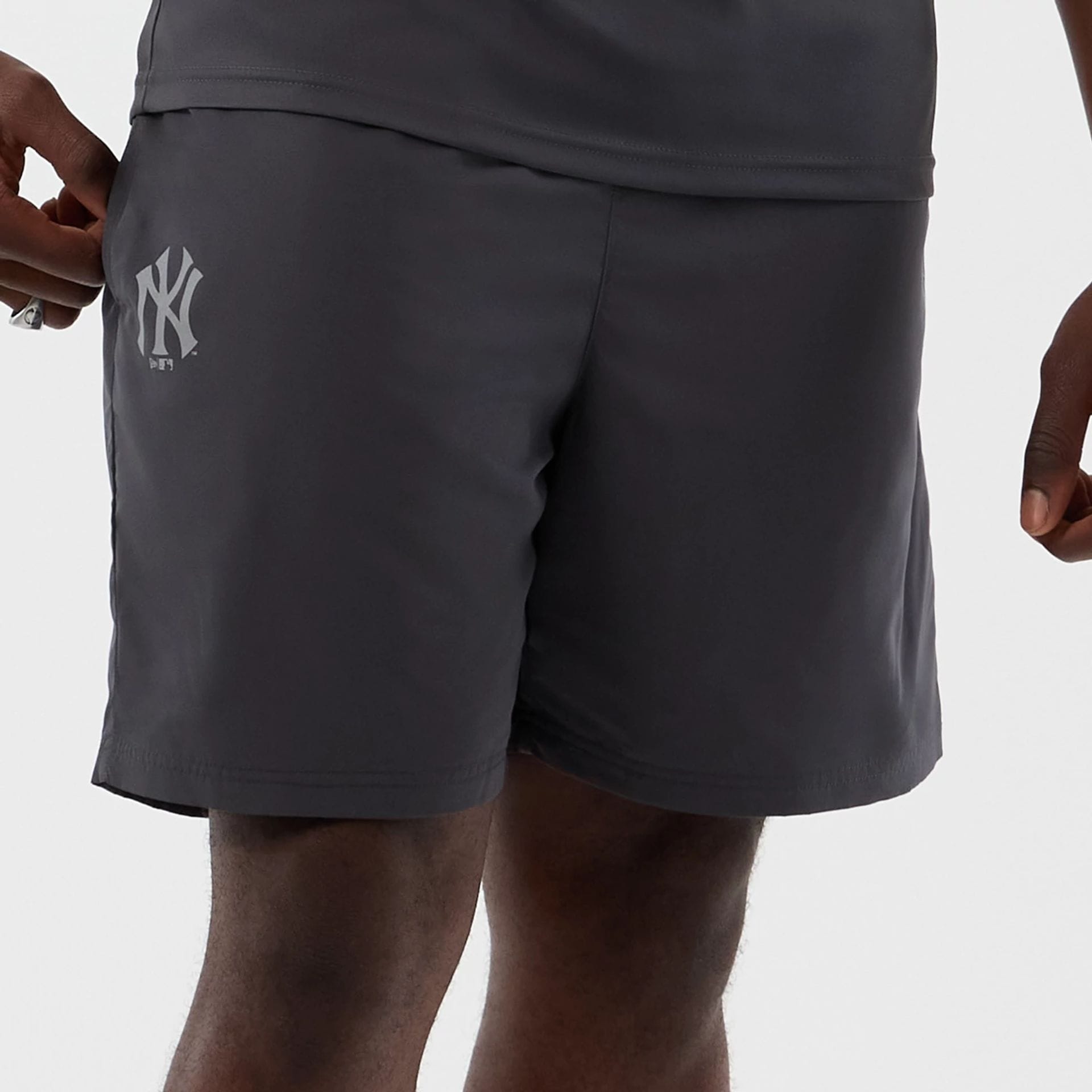 The model is wearing this MLB Core Plus New York Yankees Shorts in dark grey. 5