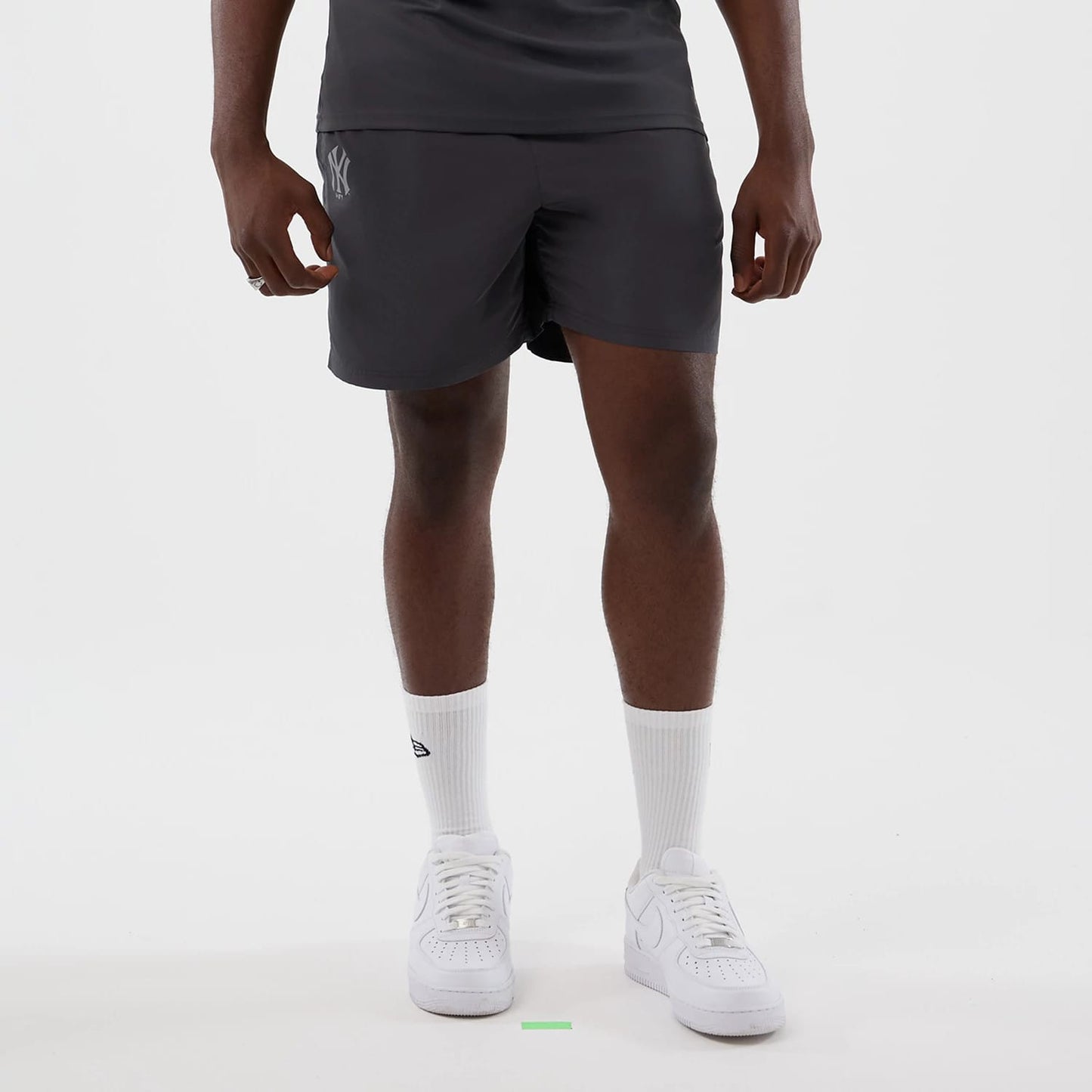 The model is wearing this MLB Core Plus New York Yankees Shorts in dark grey. 1