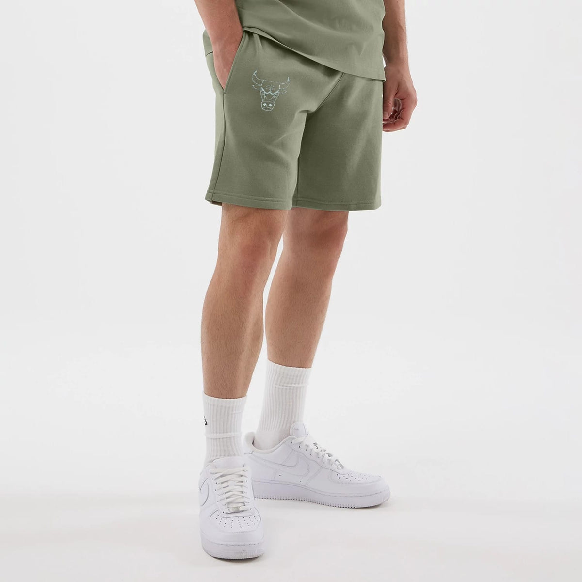 The model is wearing this NBA League Essential Chicago Bulls Shorts in pastel green. 7