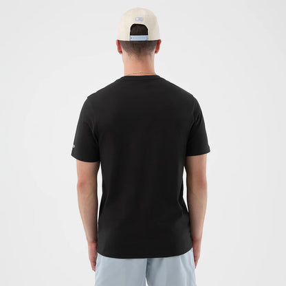 The model is wearing this New Era Logo Graphic T-Shirt in black. 2