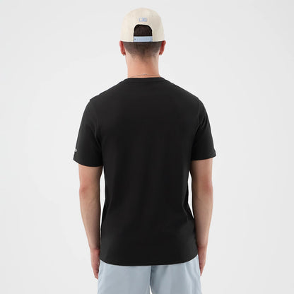 The model is wearing this New Era Logo Graphic T-Shirt in black. 2