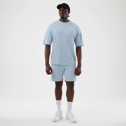 The model is wearing this NBA League Essential LA Lakers Oversized T-Shirt in pastel blue. 8