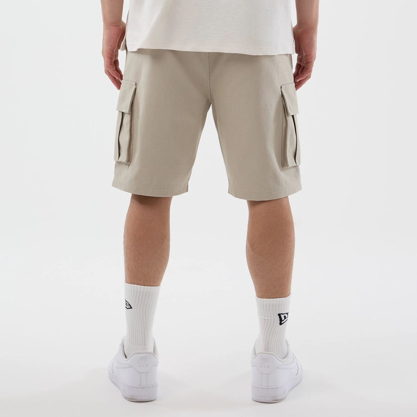 The model is wearing this New Era Cargo Shorts in light beige. 7