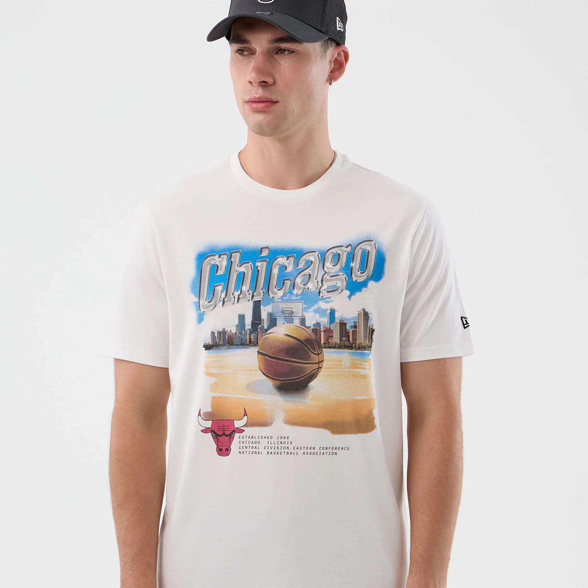 The model is wearing this NBA Beach Graphic Chicago Bulls T-Shirt in white. 3