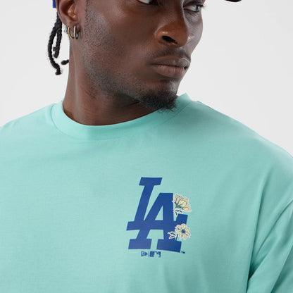 The model is wearing this MLB Floral LA Dodgers Oversized T-Shirt in pastel green. 5