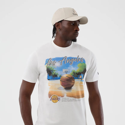 The model is wearing this NBA Beach Graphic LA Lakers T-Shirt in white. 3