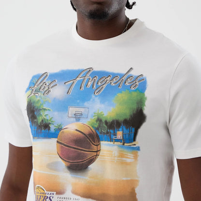The model is wearing this NBA Beach Graphic LA Lakers T-Shirt in white. 4