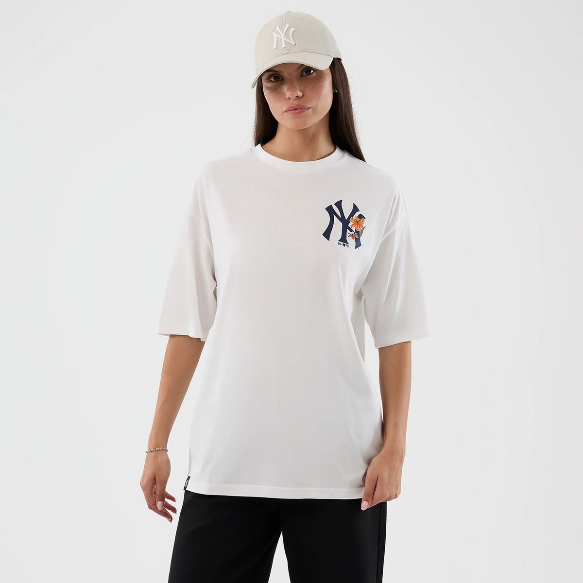 The model is wearing this MLB Floral New York Yankees Oversized T-Shirt in white. 5