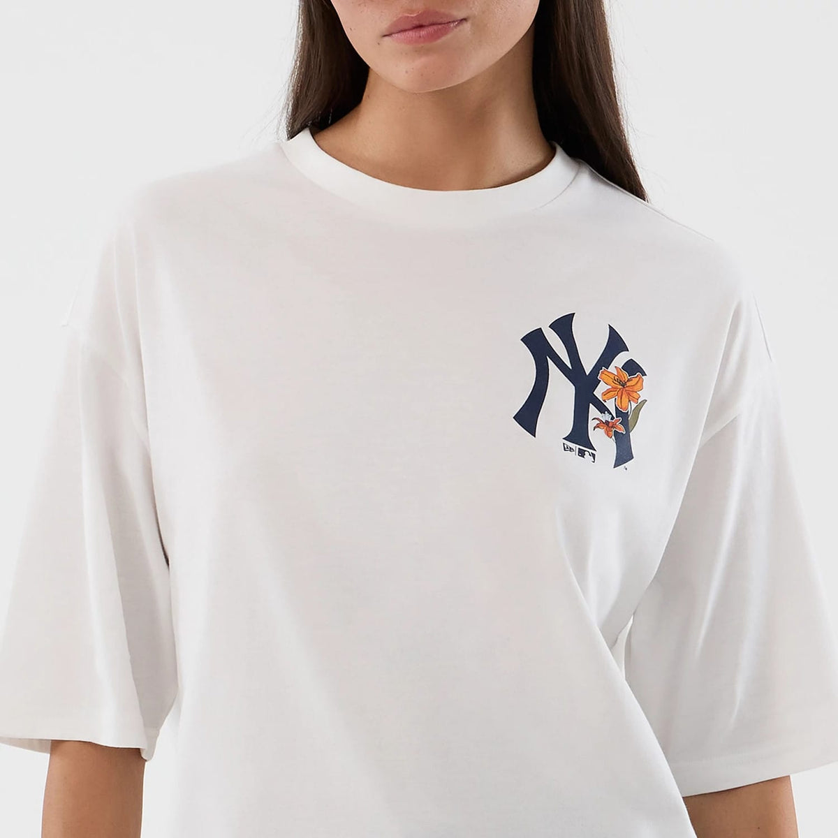 The model is wearing this MLB Floral New York Yankees Oversized T-Shirt in white. 6