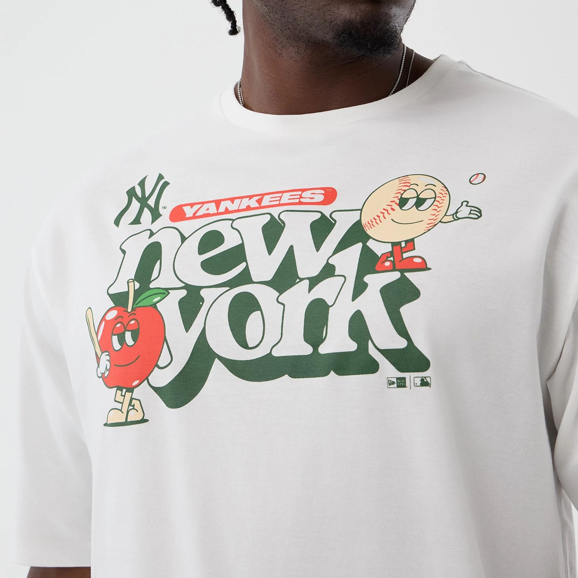 The model is wearing this MLB Icon Graphic New York Yankees T-Shirt in white. 4