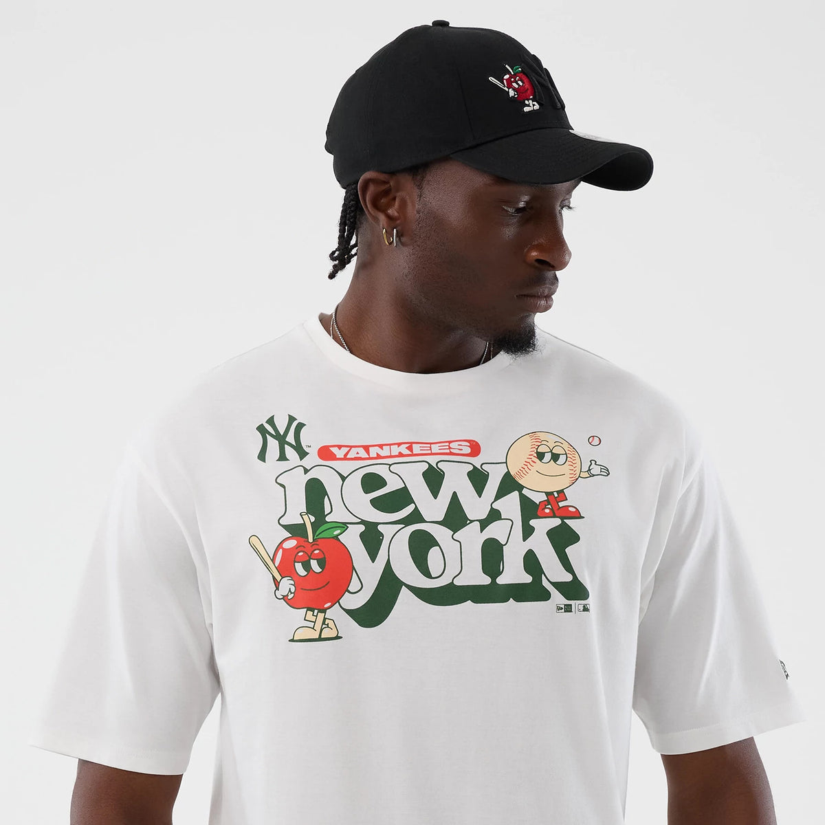 The model is wearing this MLB Icon Graphic New York Yankees T-Shirt in white. 6