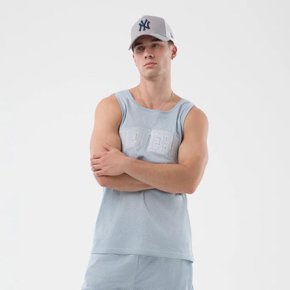 The model is wearing this New Era Mesh Oversized Tank Top in pastel blue. 6