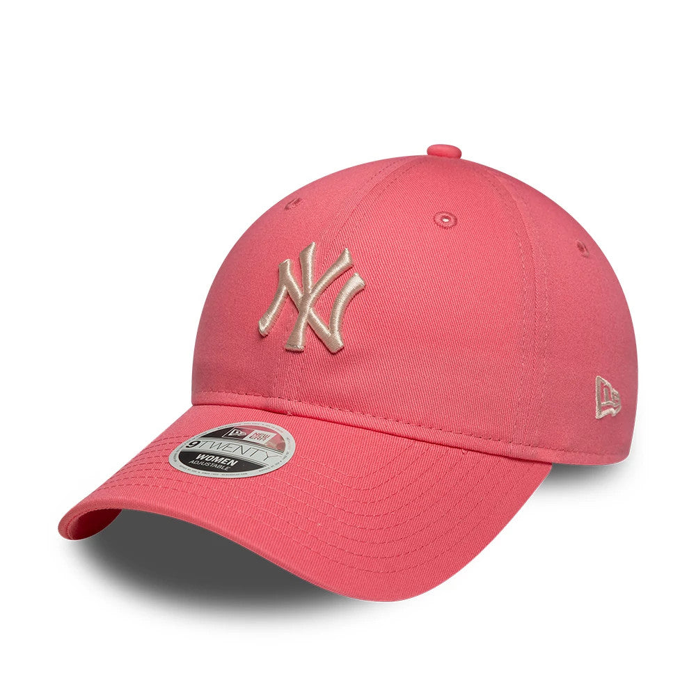 New York Yankees Womens MLB League Essential Pink New Era 9TWENTY Adjustable Cap, three-quarter view showing the raised embroidered NY logo on the front panel, pink curved visor with a 9TWENTY size sticker, and New Era flag logo on the left side.