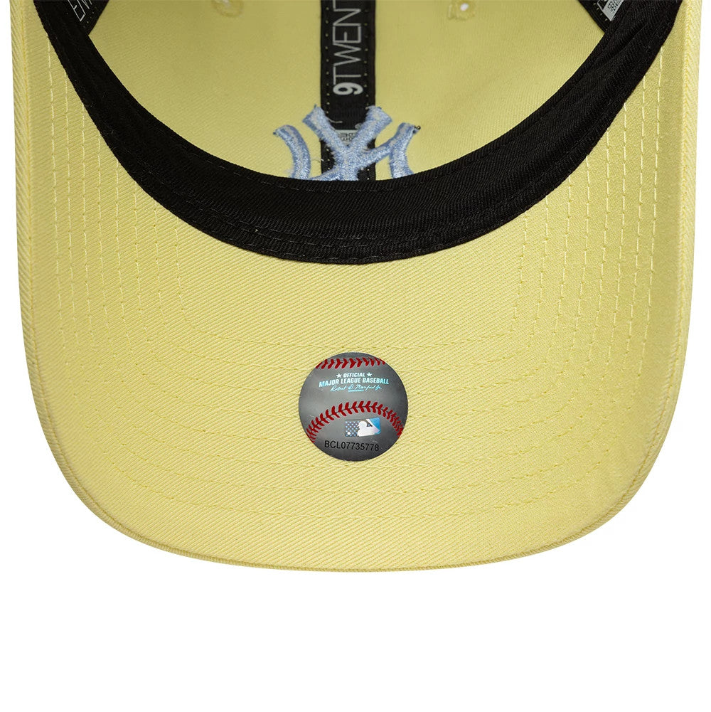 New York Yankees Womens MLB League Essential Pastel Yellow New Era 9TWENTY Adjustable Cap, inside view showing the pastel yellow undervisor with a silver MLB holographic sticker, black sweatband, and New Era taping alongside the NY logo.
