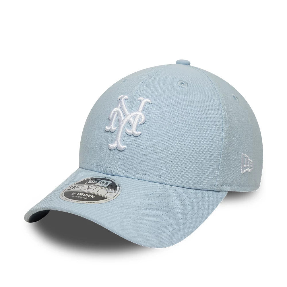 New York Mets MLB Linen Pastel Blue New Era 9FORTY M-Crown Adjustable Cap, three-quarter view showing the white embroidered Mets logo on the front panel, curved visor with a 9FORTY size sticker, and New Era flag logo on the left side.