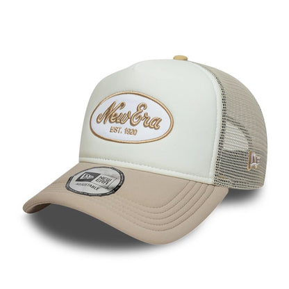 Pictured is this New Era Oval Patch 9FORTY A-Frame Trucker cap in Beige. 1