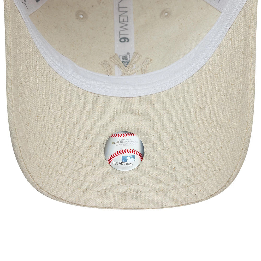 New York Yankees Womens MLB Linen Light Beige New Era 9TWENTY Adjustable Cap, inside view showing a beige undervisor with an MLB baseball sticker, white sweatband around the edge, and 9TWENTY taping along the centre.