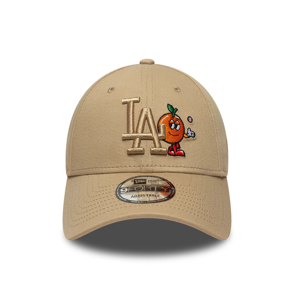 LA Dodgers MLB Icon Beige New Era 9FORTY Adjustable Cap, front view showing a raised embroidered white LA logo beside a cartoon orange character with red shoes on the front panel, with a 9FORTY size sticker on the beige curved visor.