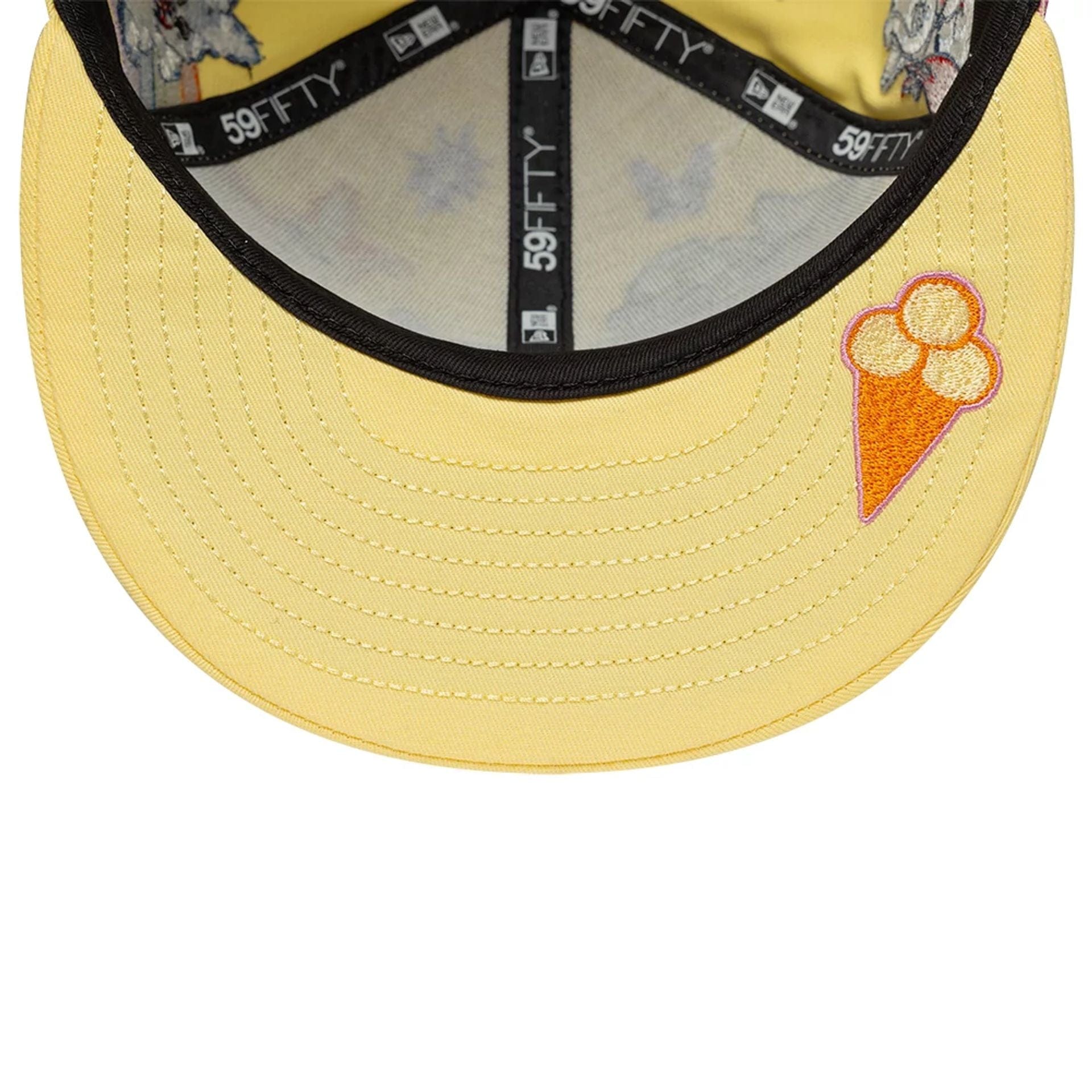 Pictured is this Kenzo X New Era  59FIFTY Fitted cap in pastel yellow. 2
