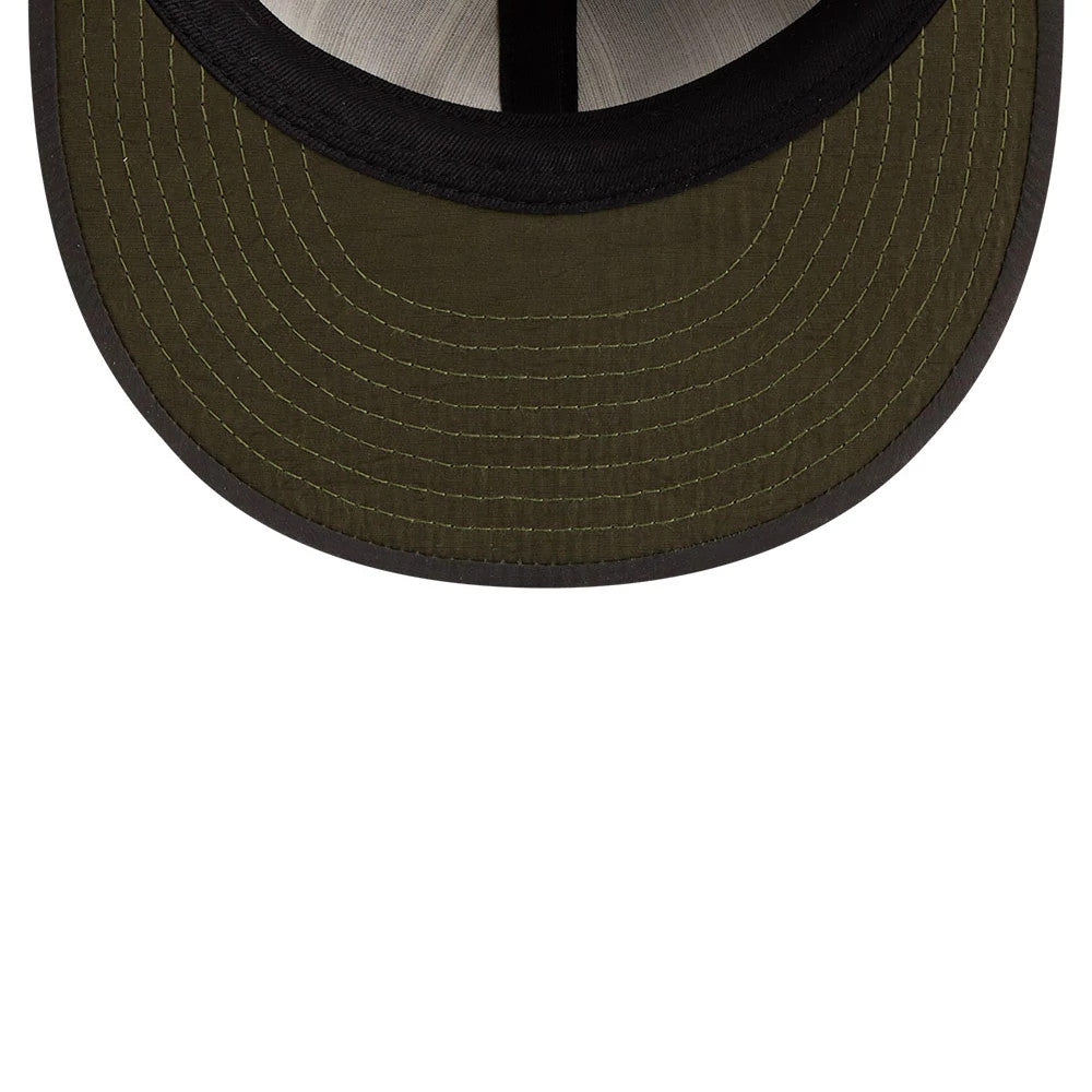 Chicago Cubs MLB Nylon Black Retro Crown New Era 9FIFTY Adjustable Cap, inside view showing a dark green undervisor with detailed stitching, a contrasting black edge trim, and a black sweatband.