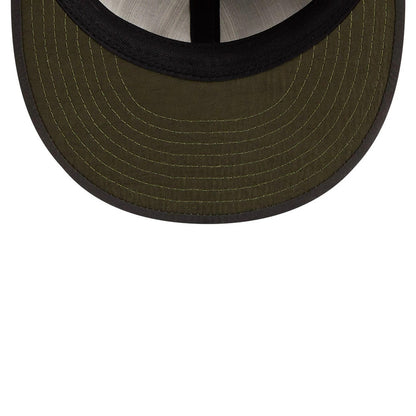 Chicago Cubs MLB Nylon Black Retro Crown New Era 9FIFTY Adjustable Cap, inside view showing a dark green undervisor with detailed stitching, a contrasting black edge trim, and a black sweatband.