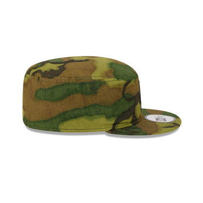 New Era LA Dodgers MLB Ripstop Camo Painter Cap, side view with a structured, flat crown and a woodland camo pattern, featuring a short, flat visor and an adjustable strap at the back for a snug fit.
