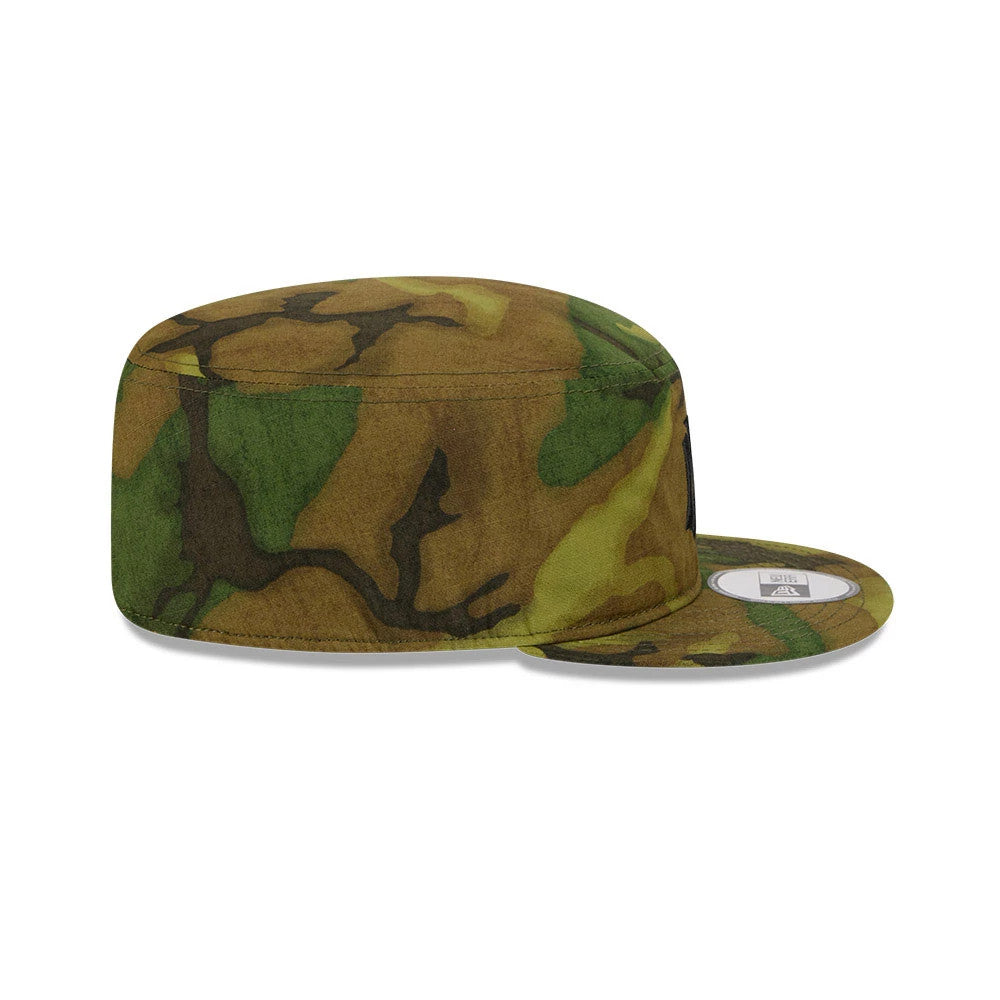 New Era New York Yankees MLB Ripstop Camo Painter Cap, side view with a structured camo-patterned crown and flat visor, featuring an embroidered Yankees logo on the front panel and a white size sticker on the visor.