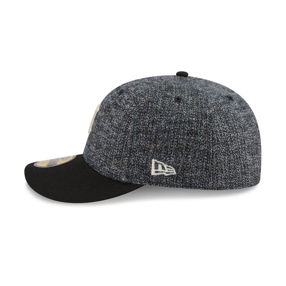 Detroit Tigers MLB Tweedy Cotton Black New Era 59FIFTY Fitted Cap, side view showing the embroidered New Era flag logo on the left side, with a textured tweed crown and a curved black visor featuring a gold 59FIFTY size sticker.