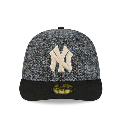 New York Yankees MLB Tweedy Cotton Black New Era 59FIFTY Fitted Cap, front view showing a raised beige embroidered NY logo on a textured tweedy cotton crown, a solid black flat visor with a gold 59FIFTY size sticker centrally placed.