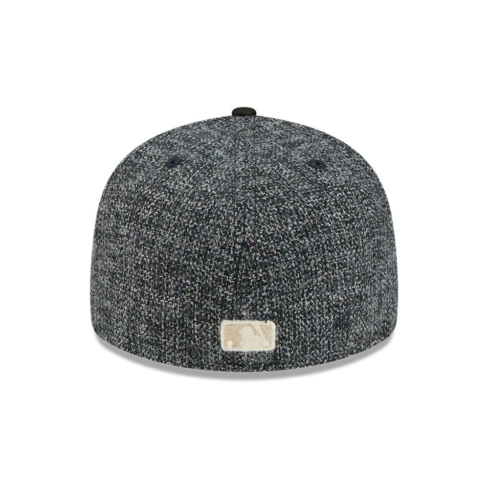 New York Yankees MLB Tweedy Cotton Black New Era 59FIFTY Fitted Cap, rear view showing the cream MLB Batterman logo centred at the back of the tweedy black crown, with matched black top button and embroidered eyelets.