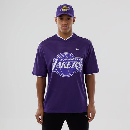 The model is wearing this NBA Mesh LA Lakers Oversized T-Shirt in purple. 1