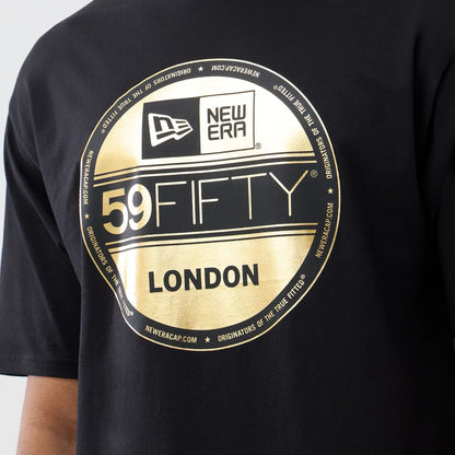 The model is wearing this New Era Sticker London Oversized T-Shirt in black. 3