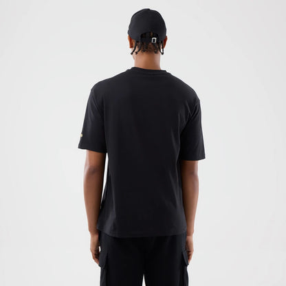 The model is wearing this New Era Sticker Copenhagen Oversized T-Shirt in black. 2