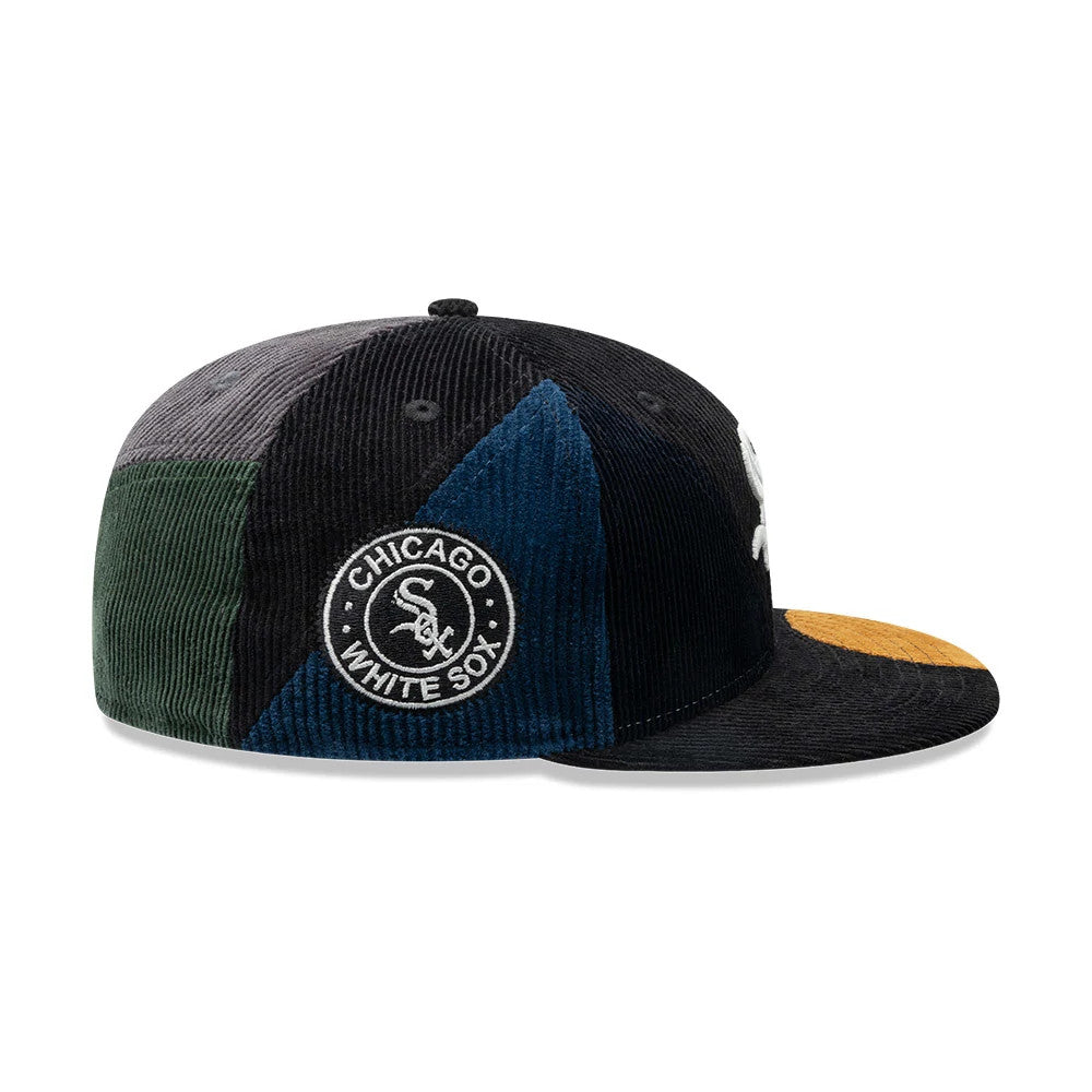 Chicago White Sox MLB Patchwork Black New Era 59FIFTY Fitted Cap, side view showing the embroidered Chicago White Sox logo on a patchwork pattern with panels in black, blue, green, and grey, featuring a mustard yellow flat visor.