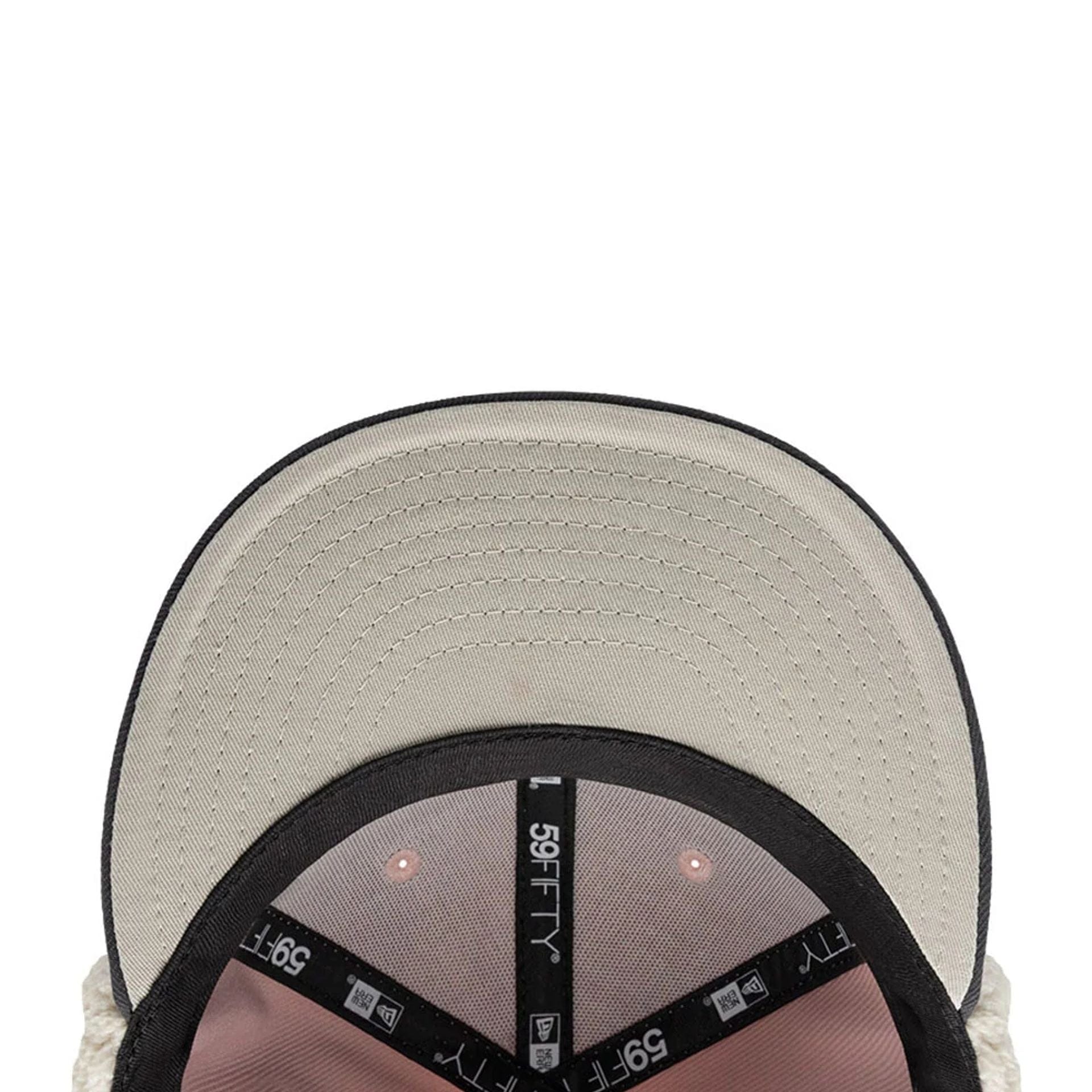 Pictured is this NHL Patch Chicago Blackhawks Dogear 59FIFTY Fitted cap in pastel pink. 10