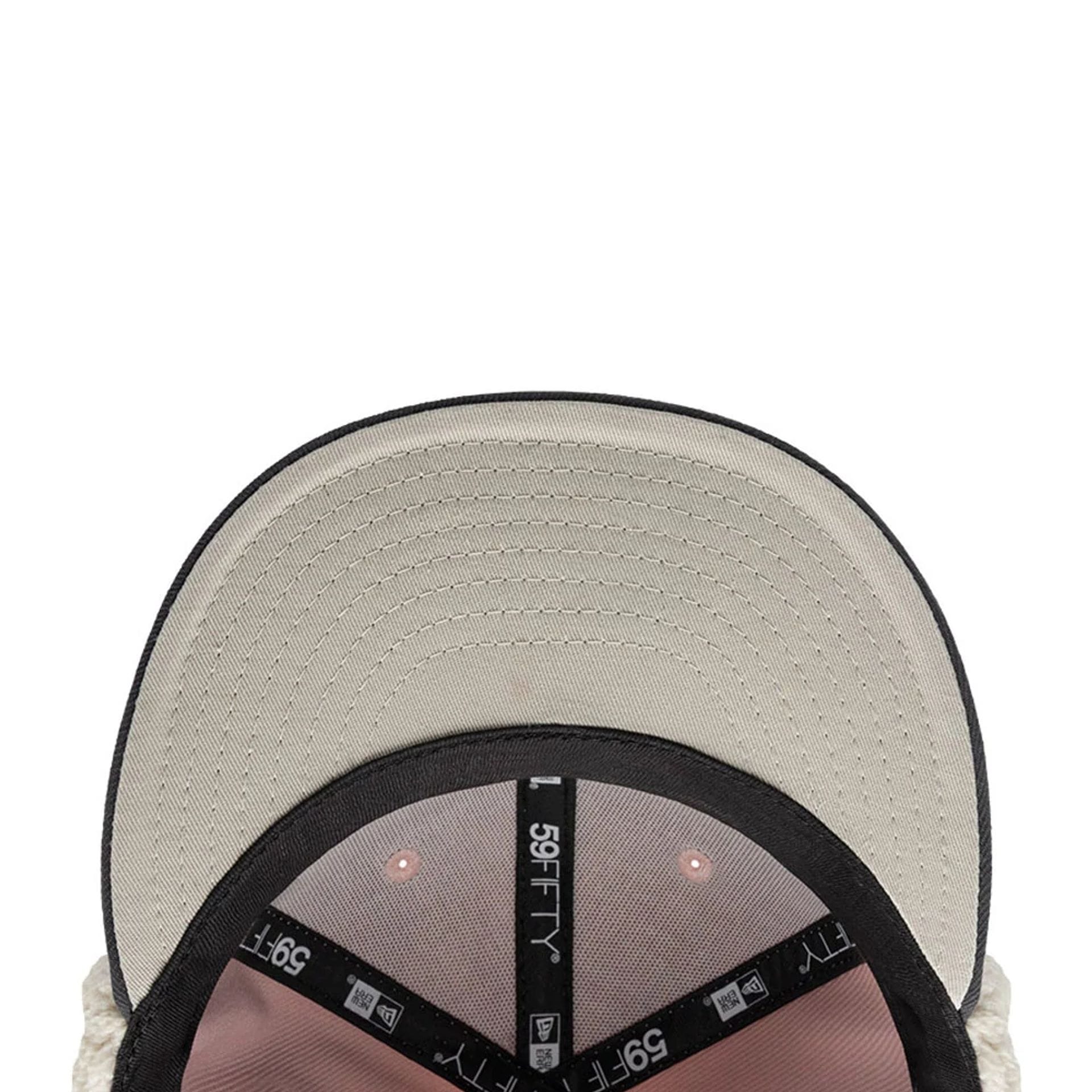 Pictured is this NHL Patch Chicago Blackhawks Dogear 59FIFTY Fitted cap in pastel pink. 10