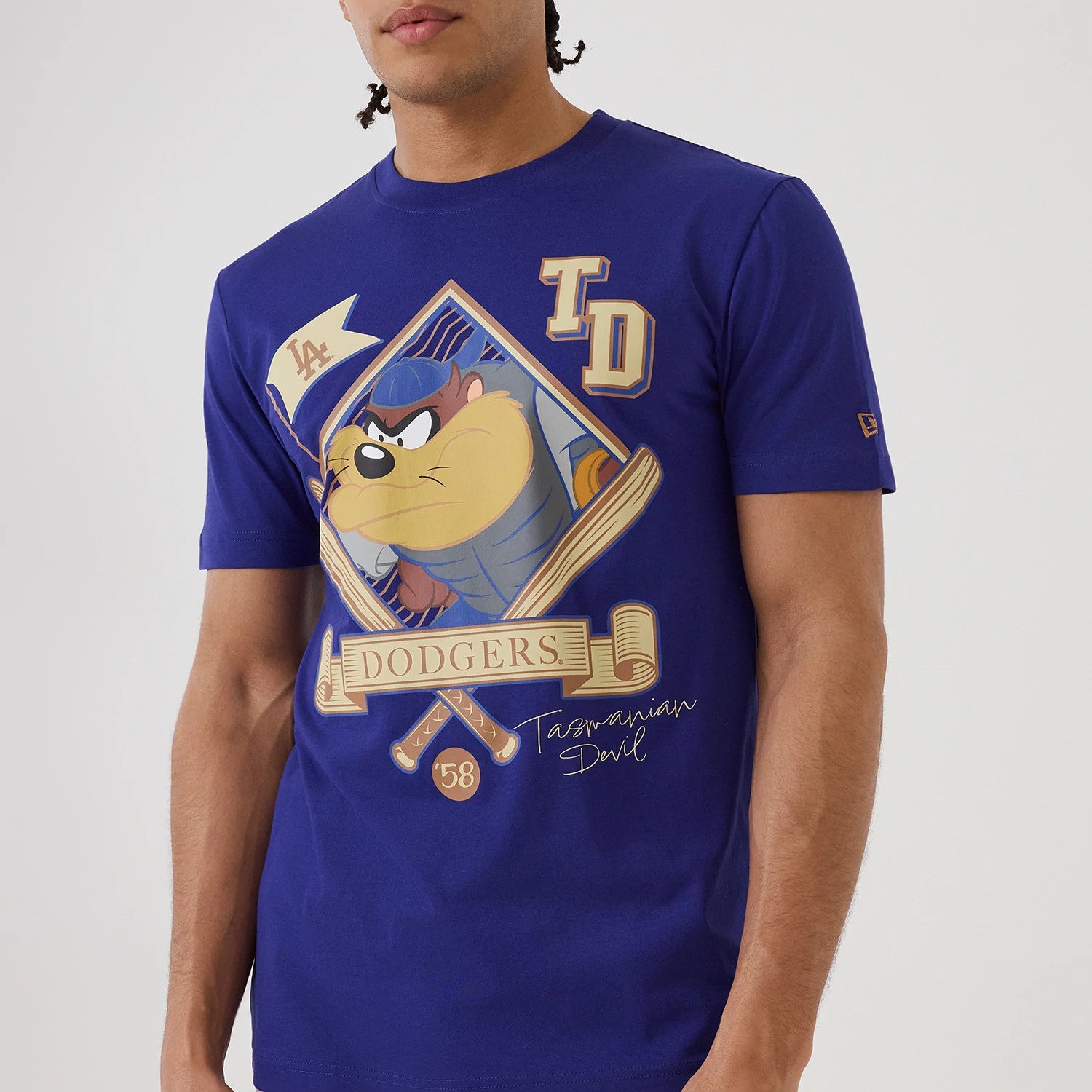 The model is wearing this MLB X Looney Tunes LA Dodgers T-Shirt in dark blue. 4