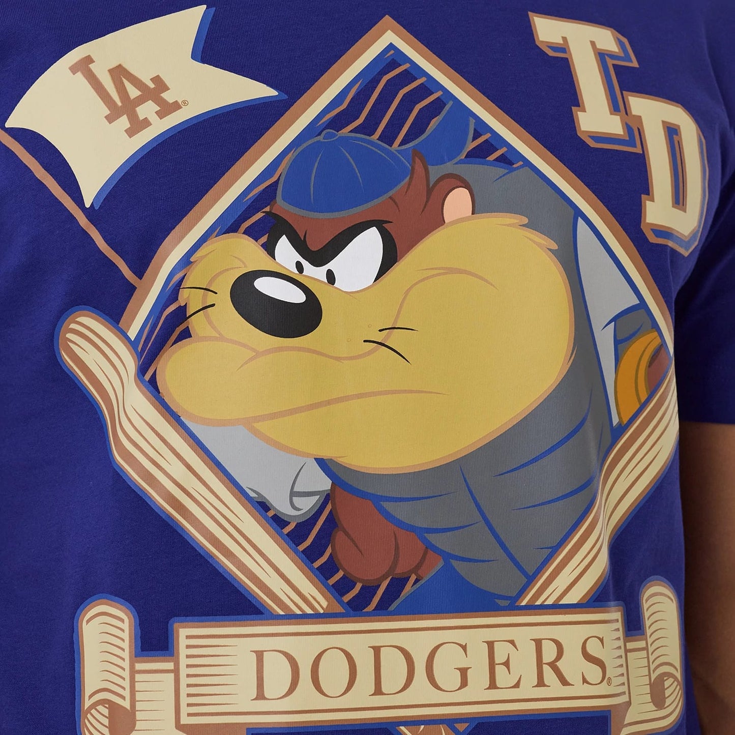 The model is wearing this MLB X Looney Tunes LA Dodgers T-Shirt in dark blue. 3