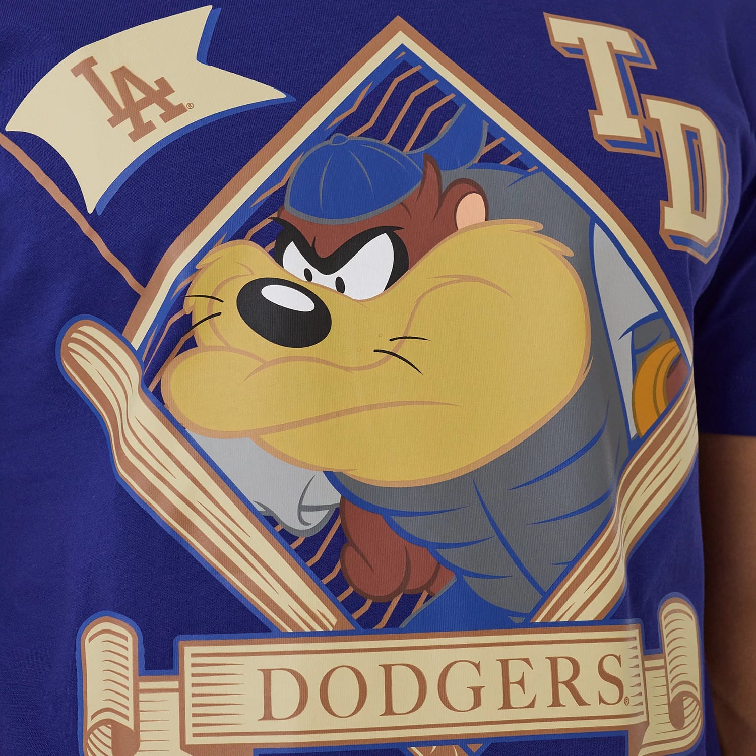 The model is wearing this MLB X Looney Tunes LA Dodgers T-Shirt in dark blue. 3