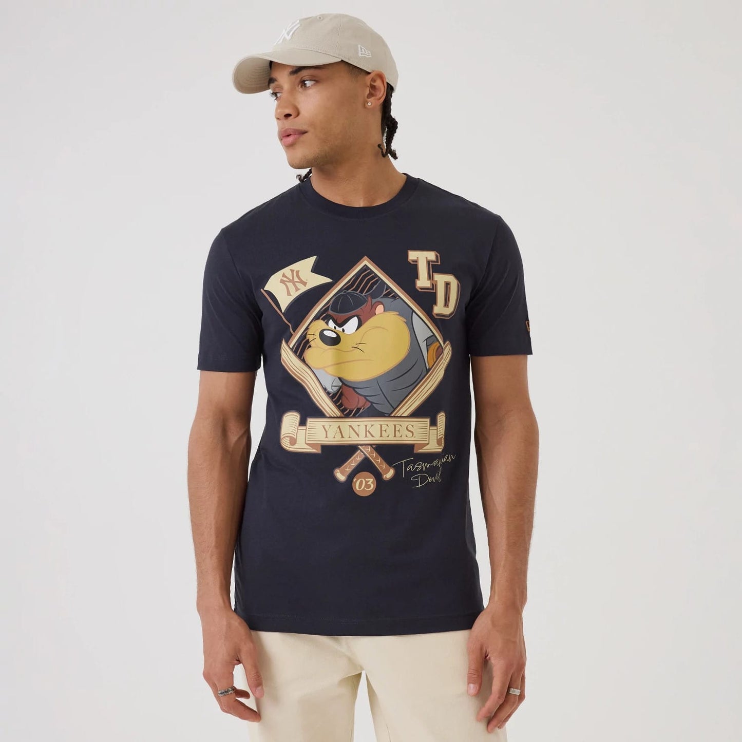 The model is wearing this MLB X Looney Tunes New York Yankees T-Shirt in navy. 1