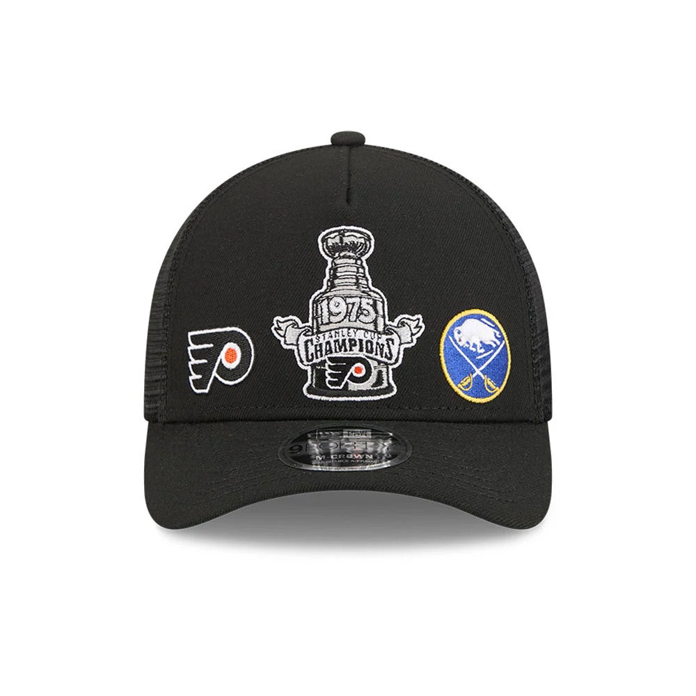 Flyers NHL Stanley Cup Black New Era 9FORTY M-Crown A-Frame Trucker Adjustable Cap, front view showing embroidered 1975 Stanley Cup Champions graphic on the front panel, flanked by Flyers and Sabres logos.