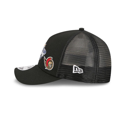 Ducks NHL Stanley Cup Black New Era 9FORTY M-Crown A-Frame Trucker Adjustable Cap, side view showing the white New Era flag logo on the black mesh back panel, structured crown, and a team logo on the front left panel.
