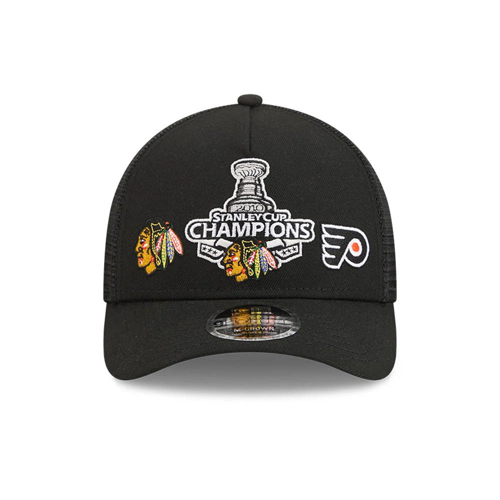 Blackhawks NHL Stanley Cup Black New Era 9FORTY M-Crown A-Frame Trucker Adjustable Cap, front view showing the embroidered 2010 Stanley Cup Champions graphic with Blackhawks and Flyers logos, complemented by a black curved visor.