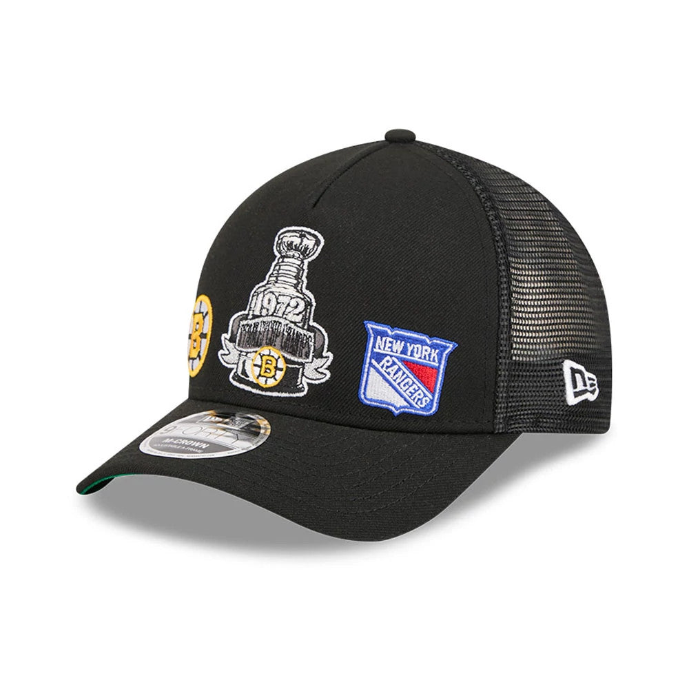 Bruins NHL Stanley Cup Black New Era 9FORTY M-Crown A-Frame Trucker Adjustable Cap, front view showing embroidered Stanley Cup and New York Rangers patches on the structured front panels, with a pre-curved black visor and 9FORTY size sticker.